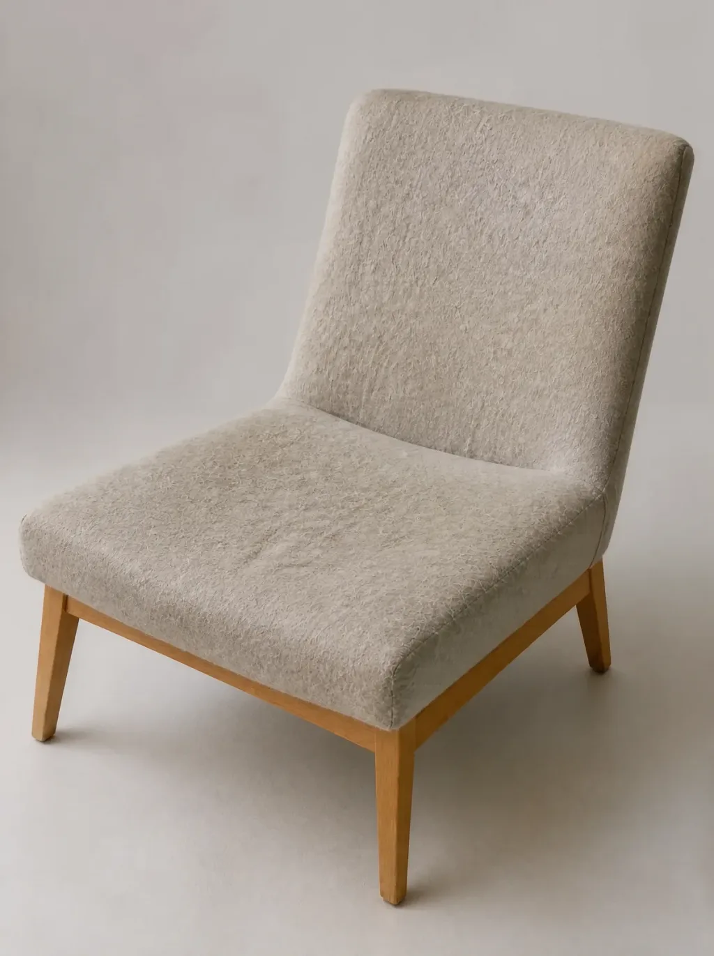 Knoll Womb Chair Möbel reparieren: Druckstelle auf der rechten Armlehne, der Wollstoff selbst unversehrt